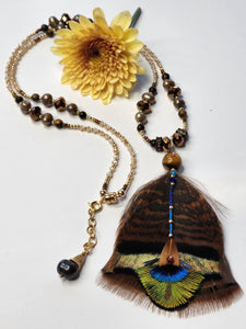 necklace of gold beads, pearls, swarovski crystal beads, turkey feathers, peacock feathers, amber beads